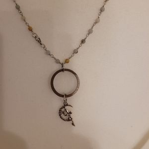 Laser cut wood pendant with silver charm